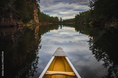 Bow of a canoe on a lake in Baron Canyon, Algonquin Park photo