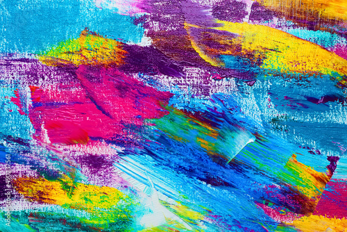 Strokes of colorful acrylic paints on canvas, closeup photo