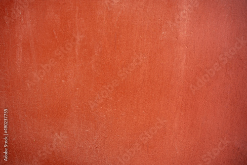 Closeup of a terracotta color background photo