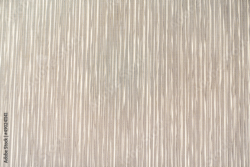 Tight grey plastic woven mat texture