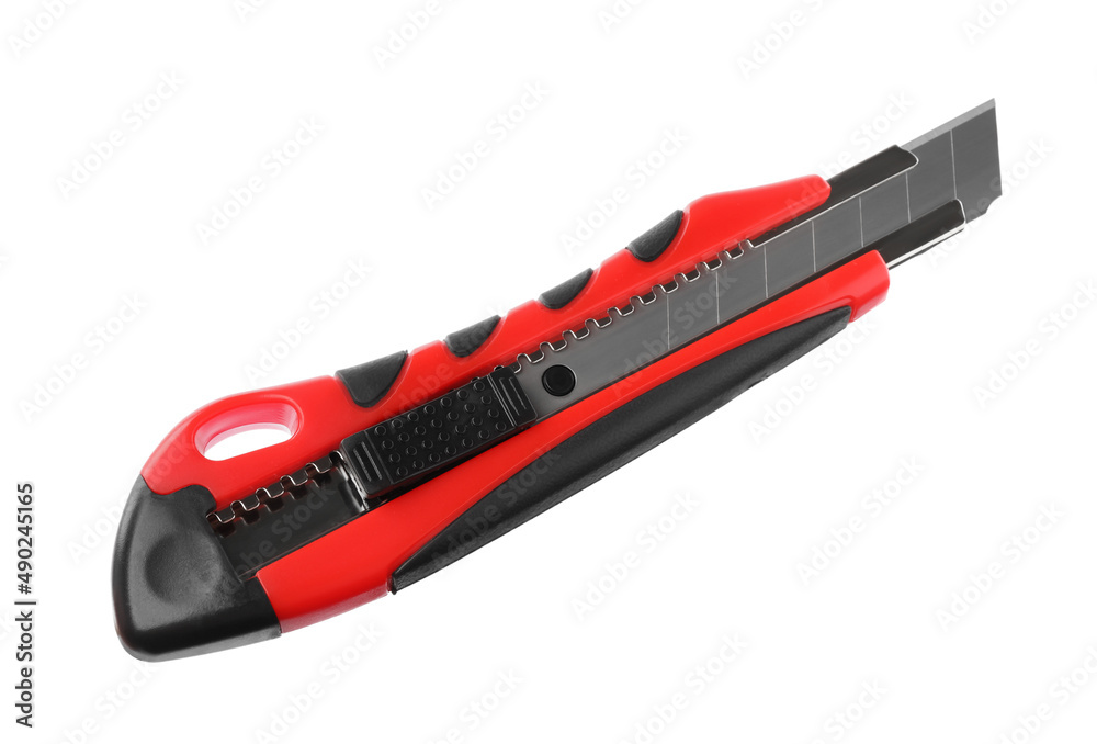 Red utility knife isolated on white. Construction tool Red utility knife isolated on white. Construction tool