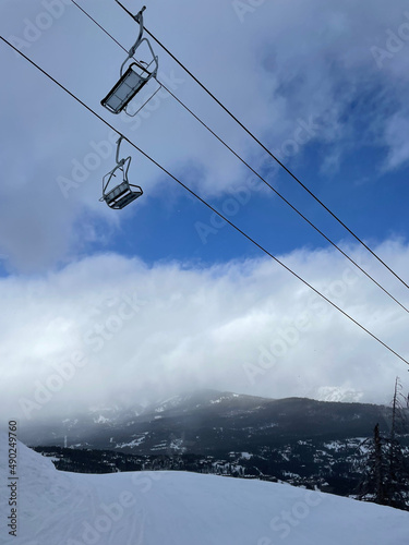 Scenic view of the chairlift and slopes at Big Sky Ski Resort on a sunny winter day