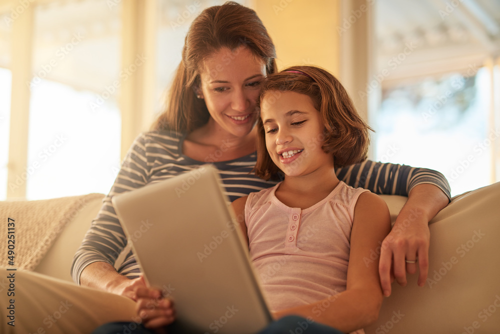 When it comes to technology, shes a natural. Cropped shot of a mother and her daughter using wireless technology at home. When it comes to technology, shes a natural. Cropped shot of a mother and her daughter using wireless technology at home.