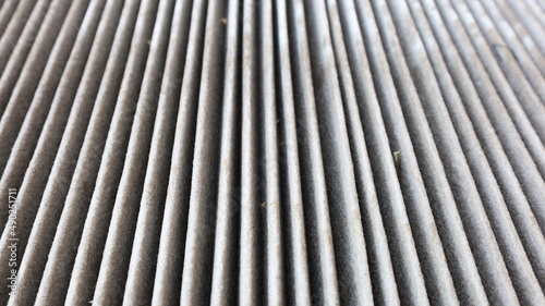 Dirty air filter background. Rows of old air filters contaminated with nasty dust. Selective focus