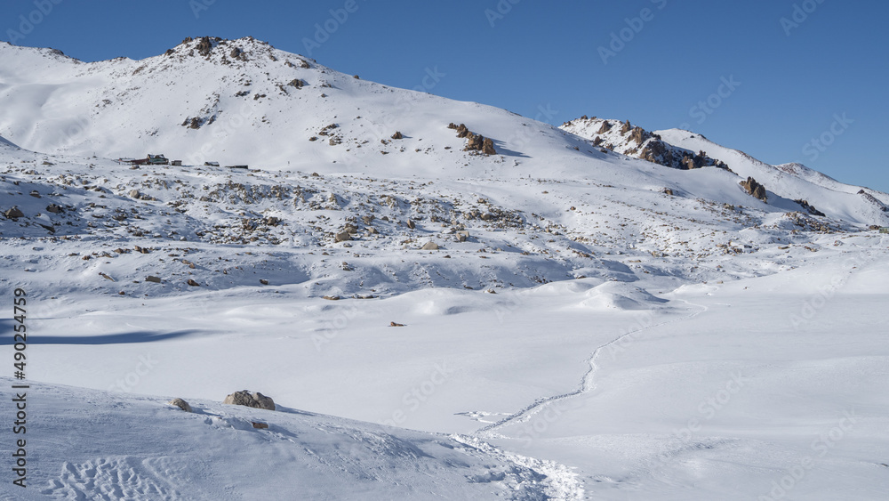 Snow-white mountains and glaciers under the snow in winter