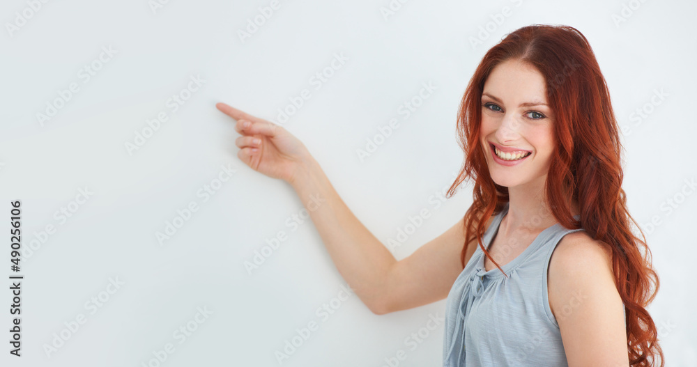 Make your headspace this space. A young woman pointing at copyspace. Make your headspace this space. A young woman pointing at copyspace.