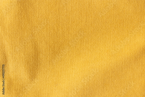 Yellow velvet skirt material close up flatlay