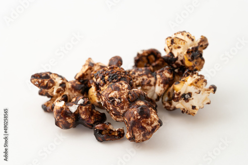 Chocolate caramel popcorn on a solid background