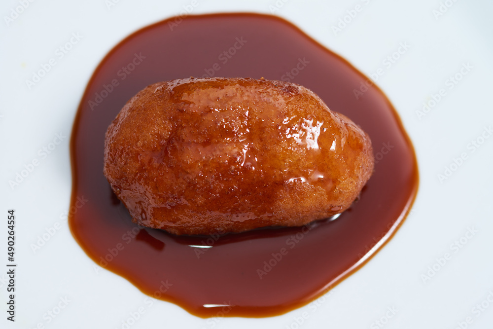 Nuegado el salvador pastry dipped in sweet caramel Nuegado el salvador pastry dipped in sweet caramel