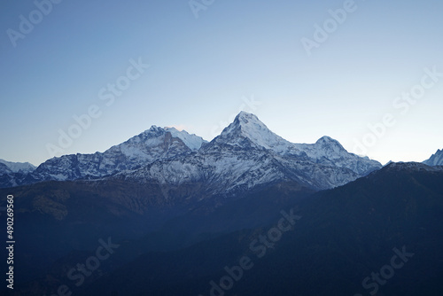 Natural landscape of Snowcapped mountain view of Poon hill with colorful prayer flags and blue sky, Annapurna Himalayan range- Ghorepani, Nepal