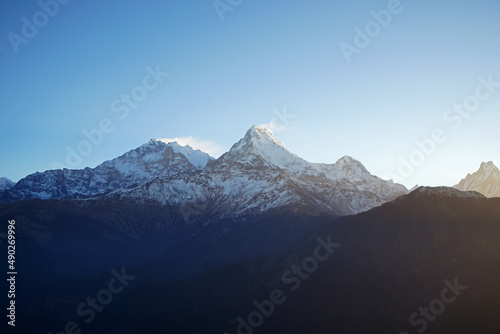 Natural landscape of Snowcapped mountain view of Poon hill with colorful prayer flags and blue sky, Annapurna Himalayan range- Ghorepani, Nepal