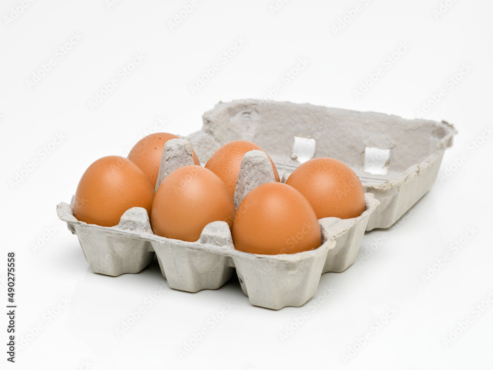 Packed full of protein. Studio shot of half a dozen brown eggs in a carton. Packed full of protein. Studio shot of half a dozen brown eggs in a carton.