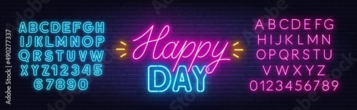Happy Day neon lettering on brick wall background.