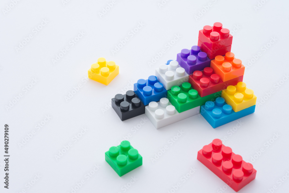 Close up color plastic block is build staircase on white background copy space. Business and finance strategy, teamwork, business management, creative idea concept. Planning is key success to target. Close up color plastic block is build staircase on white background copy space. Business and finance strategy, teamwork, business management, creative idea concept. Planning is key success to target.