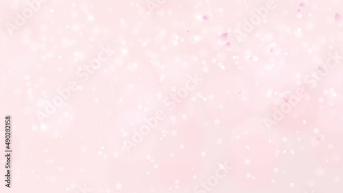 桜　薄いピンク色の花びら　右上から左下へ　舞う