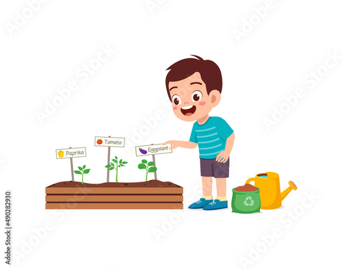 cute little boy take care of vegetable plant