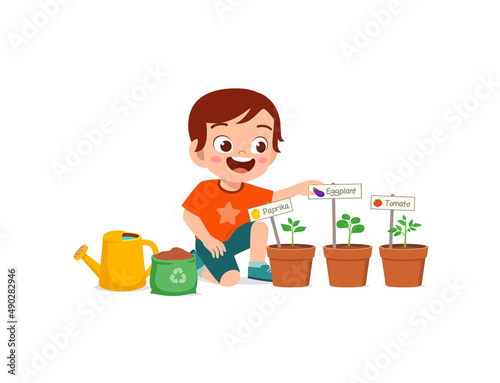 cute little boy take care of vegetable plant