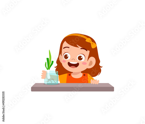 little girl observe plant growing in garden
