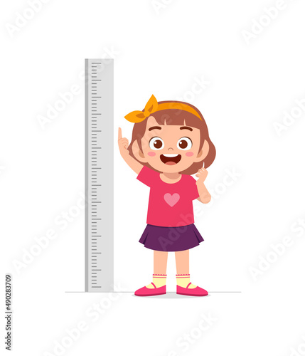 cute little girl measure height for grow progress