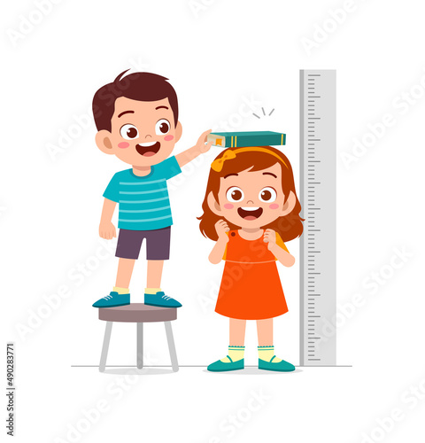 boy and girl measure height for grow progress