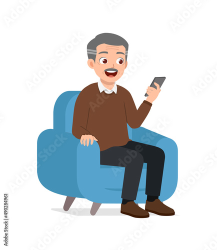 old man sit on sofa and using mobile phone