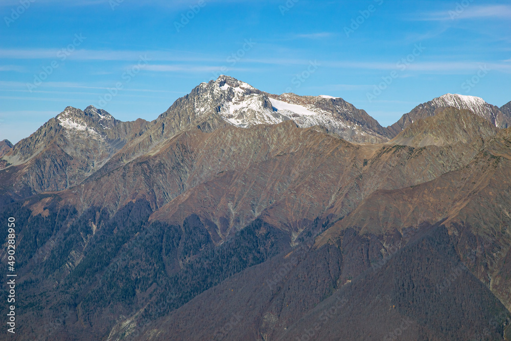 Fototapeta premium Beautiful mountain landscapes with peaks and valleys against a clear blue sky