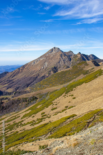 Beautiful mountain landscapes with peaks and valleys against a clear blue sky