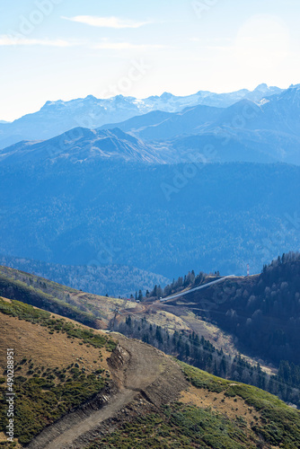 Beautiful mountain landscapes with peaks and valleys against a clear blue sky