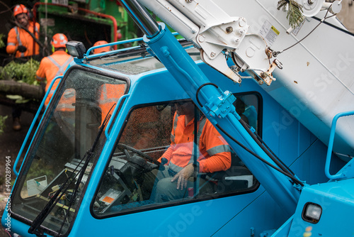 Canvas Print caucasian male man worker orange uniform blue crane machinery operator fallen tr