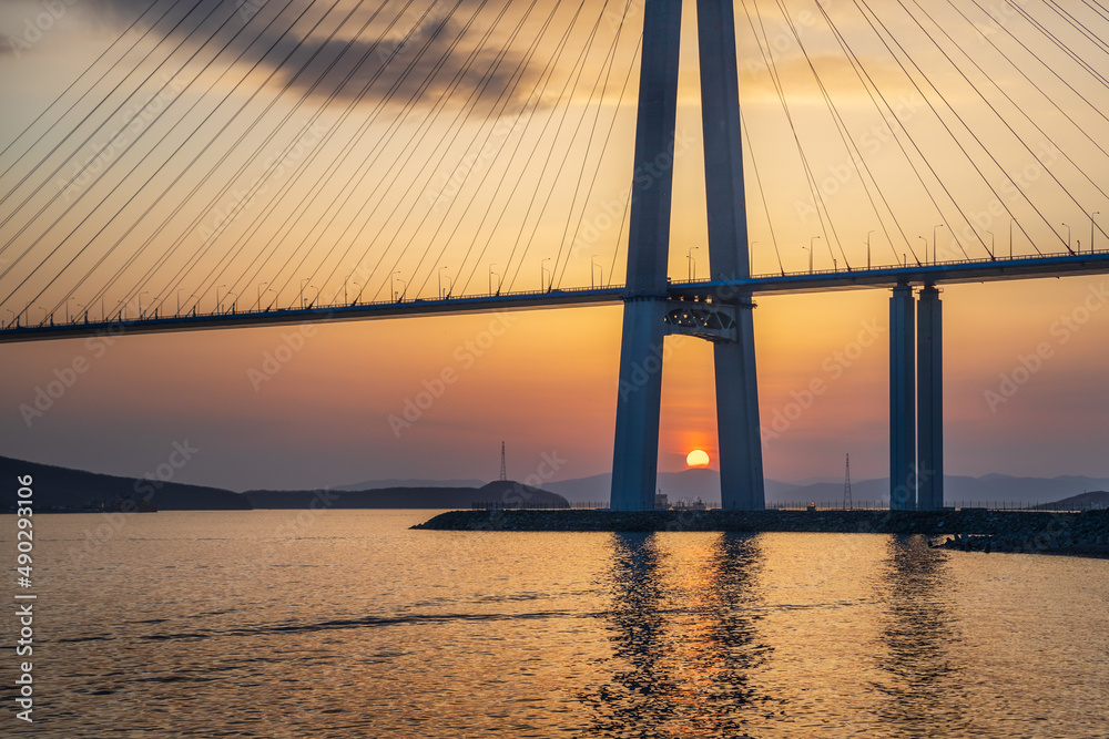 Obraz premium Sunset view of long cable-stayed bridge in Vladivostok, Far East of Russia