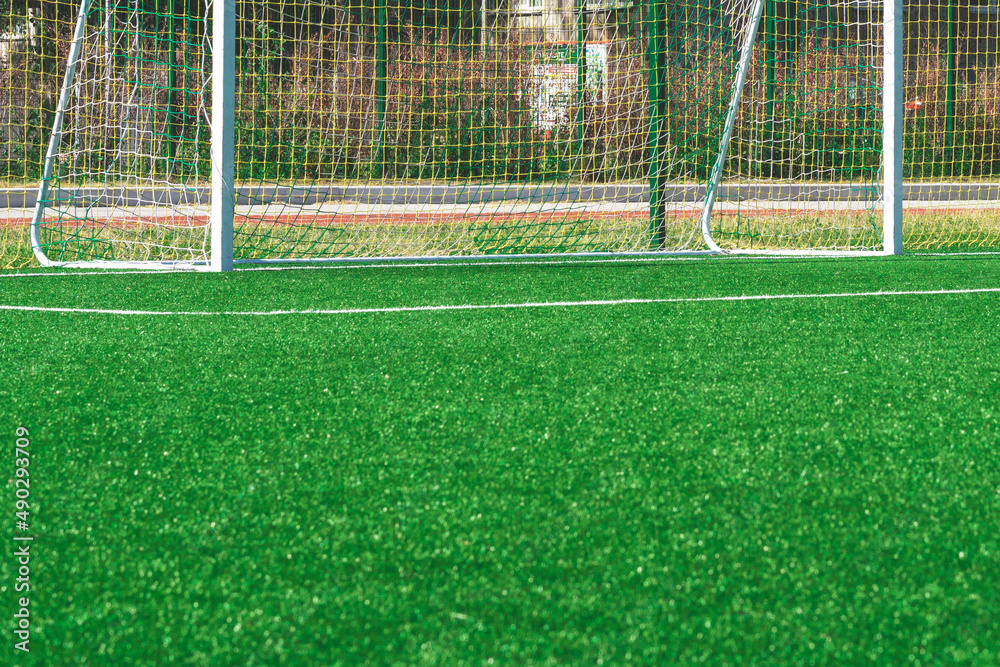Fototapeta premium soccer gates. Football goal at the stadium. Football field with artificial lawn. Concept other party of soccer. At stadium.