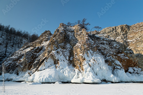 Frosty rocks covered by ice in the baikal lake shore, Siberia