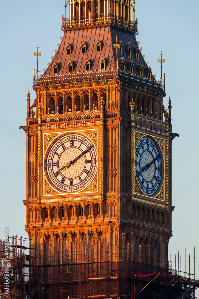 The Elizabeth Tower in Westminster, commonly known as Big Ben, against a blue sky.
