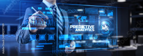 Predictive analytics. Businessman pressing button on screen. photo