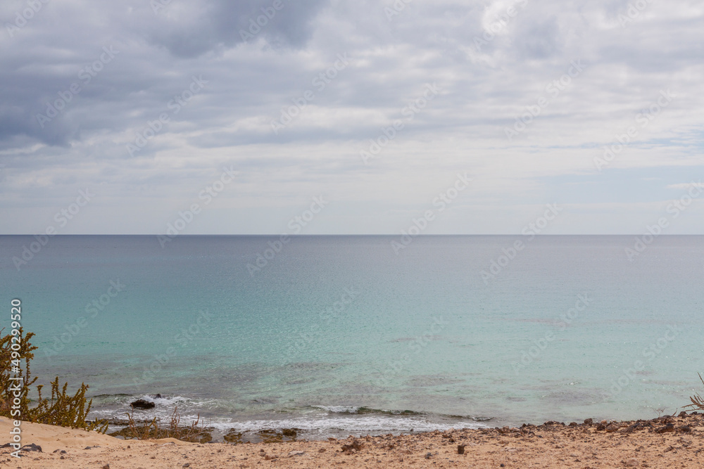 Impressive beaches of dunes and rocks with turquoise water on the island of Fuerteventura Impressive beaches of dunes and rocks with turquoise water on the island of Fuerteventura