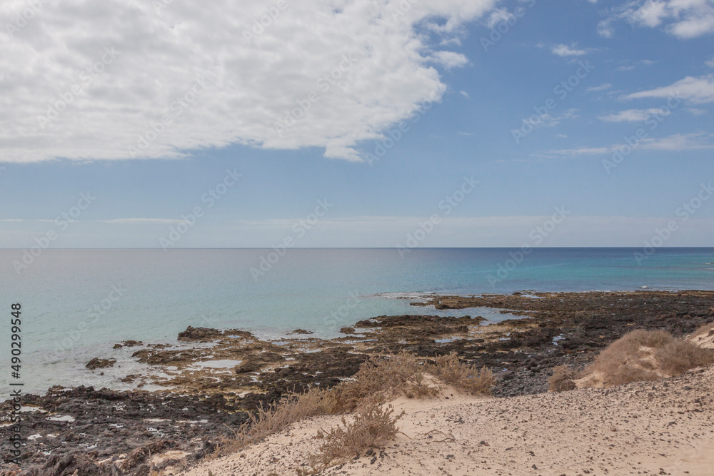 Impressive beaches of dunes and rocks with turquoise water on the island of Fuerteventura