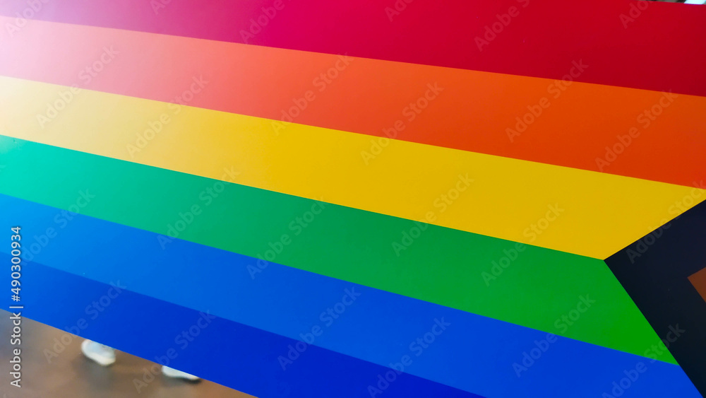 Different angles of a horizontal rainbow vibrant color sticker