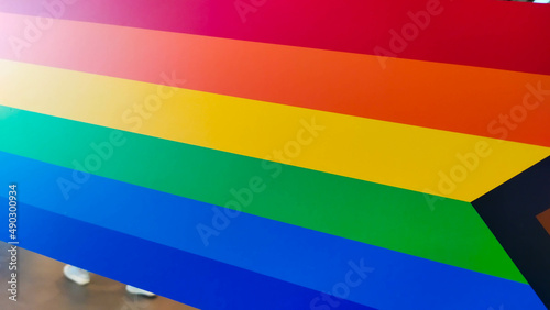Different angles of a horizontal rainbow vibrant color sticker