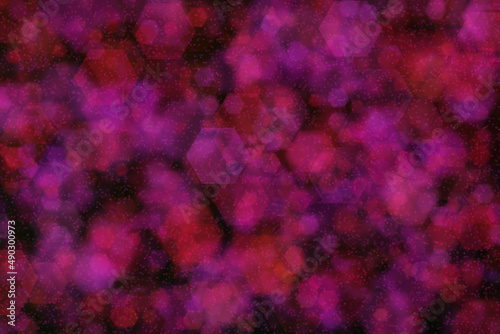 Fotografía hexagon shaped bokeh with purple and red colors on dark background