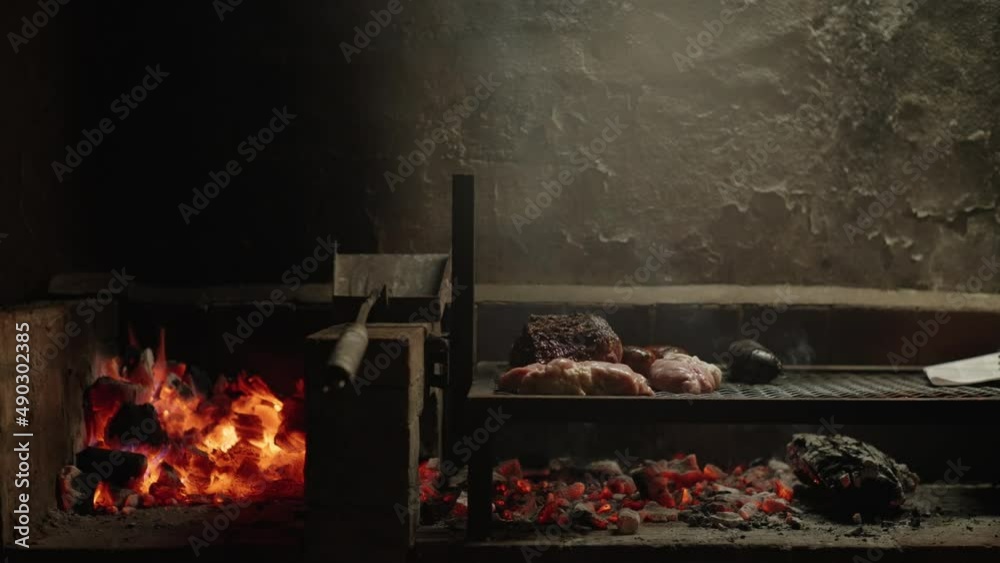 slow motion of an Argentine asado seeing all the grill and the charcoal slow motion of an Argentine asado seeing all the grill and the charcoal