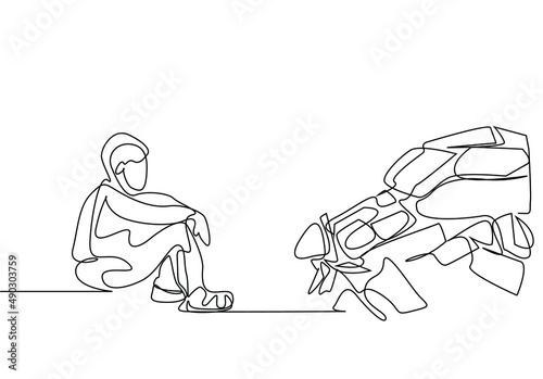 exhausted tired sad boy sitting on battlefield and thinking