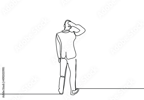 thinking worried businessman trying to make a decision holding his head with his back turned