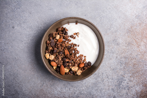 Healthy breakfast of granola with nuts  chocolate drops and yogurt