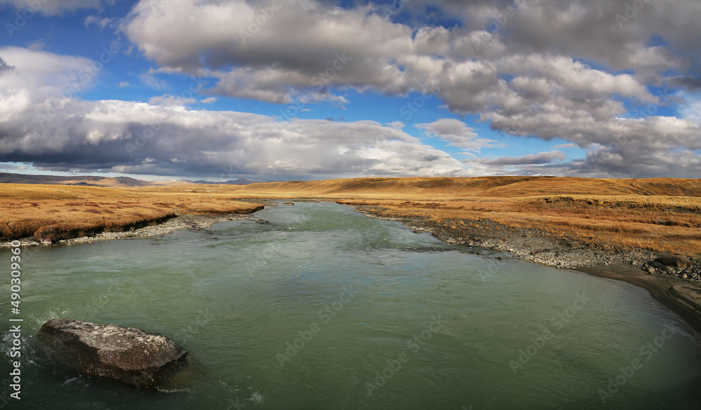River and sky, harsh landscapes of northern nature
