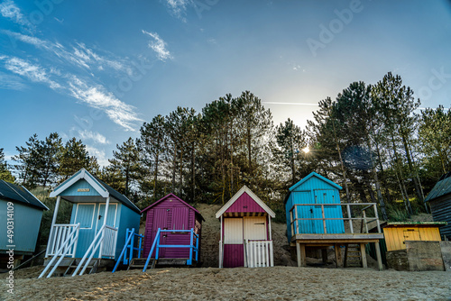 Colourful wooden beach huts at the beach © Eszter