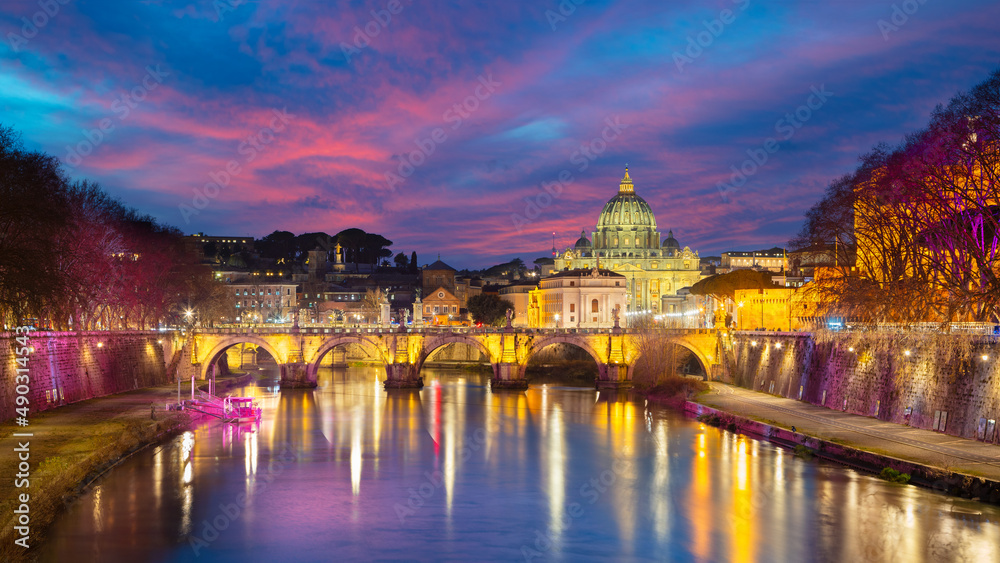 Rome, Italy. Cityscape image of Rome, Italy with the Holy Angel Bridge (Ponte Sant Angelo) and the St. Peter's Basilica at twilight blue hour.