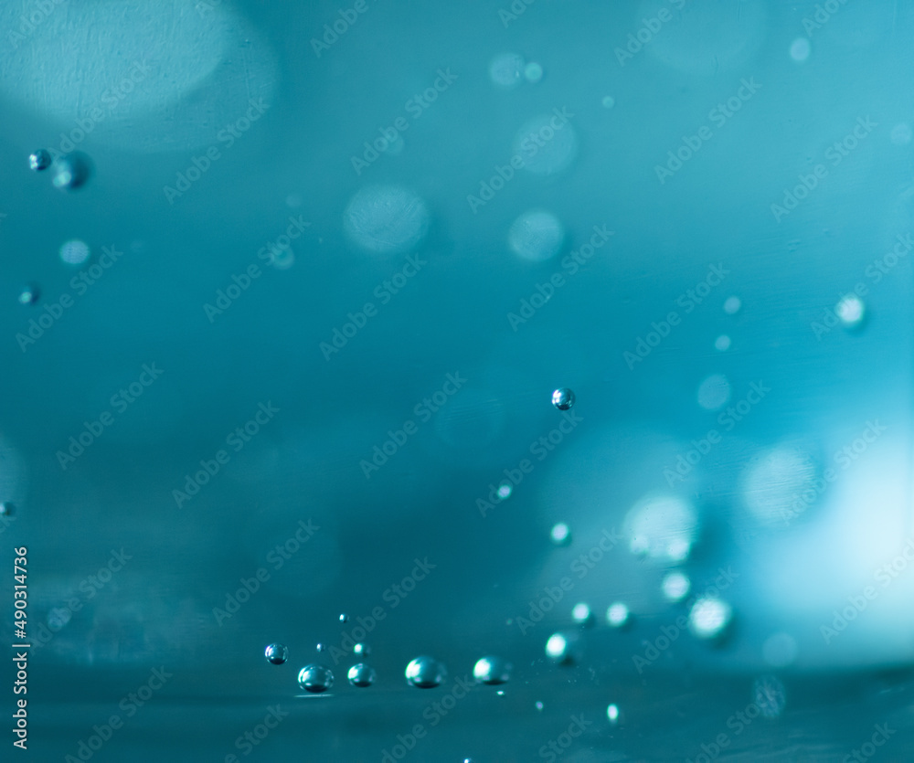 rain drops on teal background