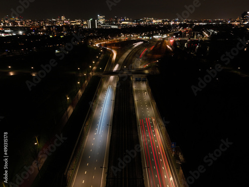 Photography Amsterdam at night, dutch infrastructure road intersection, train, road,track, metro and pedestrians