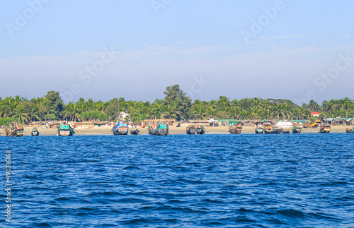 Photo of Industrial fishing boat. Fishing boat in the sea. The fishing industry in India. Indian traditional fishing boat.