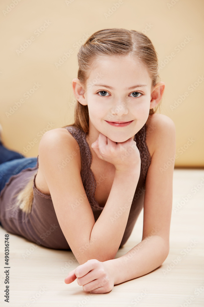 Sweet and innocent. Cropped portrait of a cute little girl smiling. Sweet and innocent. Cropped portrait of a cute little girl smiling.